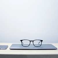 Glasses sitting on laptop