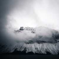 Fog over the mountaintop with snow in Banff National Park, Alberta, Canada