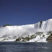 Side view of American falls from the River at Niagara Falls, Ontario, Canada
