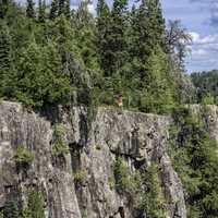 Man standing on the bluff at Ouimet Canyon Provincial Park, Ontario