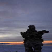 Inuksuk in the Tundra Landscape in Quebec, Canada