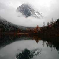 Mountain and Reflection with clouds and Mist in the water in Sichuan, China