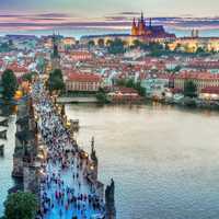 People on the bridge with cityscape in Prague, Czech Republic