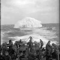 Depth charges detonate astern of the Sloop HMS Starling in World War II