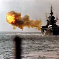 The battleship USS Idaho shells Okinawa in World War II