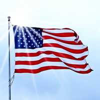 USA Flag fluttering under the sun in the wind