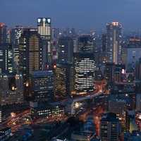 Osaka cityscape at night with skyscrapers