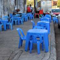 Teashop on Pavement with blue plastic tables