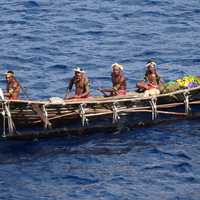 Natives in a boat in Papua New Guinea