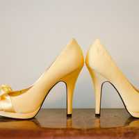 Pair of Golden Shoes with high heels