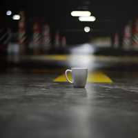 White Ceramic Coffee Cup on the ground