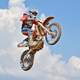 dirt-biker-jumping-into-air-with-motorcycle