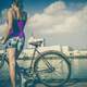 female-cyclist-looking-across-the-bay