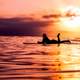 female-surfer-silhouette-on-the-ocean