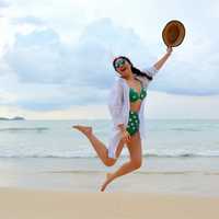 girl-jumping-for-joy-on-the-beach