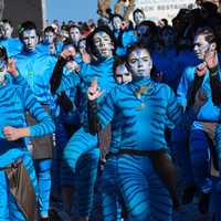 group-of-people-in-blue-face-paint-and-costumes
