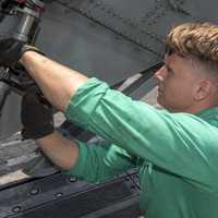Navy Mechanic working on Helicopter