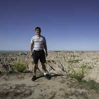 Standing on the edge of a cliff at Badlands National Park