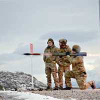 Three Soldiers firing a rocket launchers