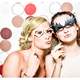 two-girls-in-a-photo-booth-with-masks