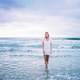 woman-dress-in-white-standing-in-the-sea