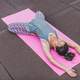 woman-on-a-pink-mat-doing-yoga