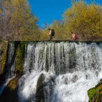 Old Fossil Creek Dam with fisherman on top