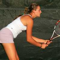 Girl ready to return a volley in tennis