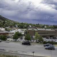 Cars and buildings under cloudy sky in Helena, Montana