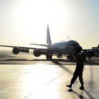 Airman and airplane at the airport or base