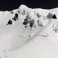 Snow capped peak with climbers on Mount Hood