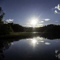 Bright Sun over Day lake in Chequamegon National Forest, Wisconsin