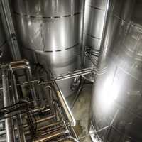 Large metal tanks and machinery at New Glarus Brewery