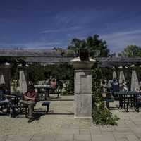 People sitting at old-fashion outdoors tables at New Glarus Brewery