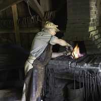 Blacksmith working at the Forge