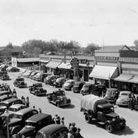Parade of vehicles from Civilian Conservation Corps in Lovell Wyoming
