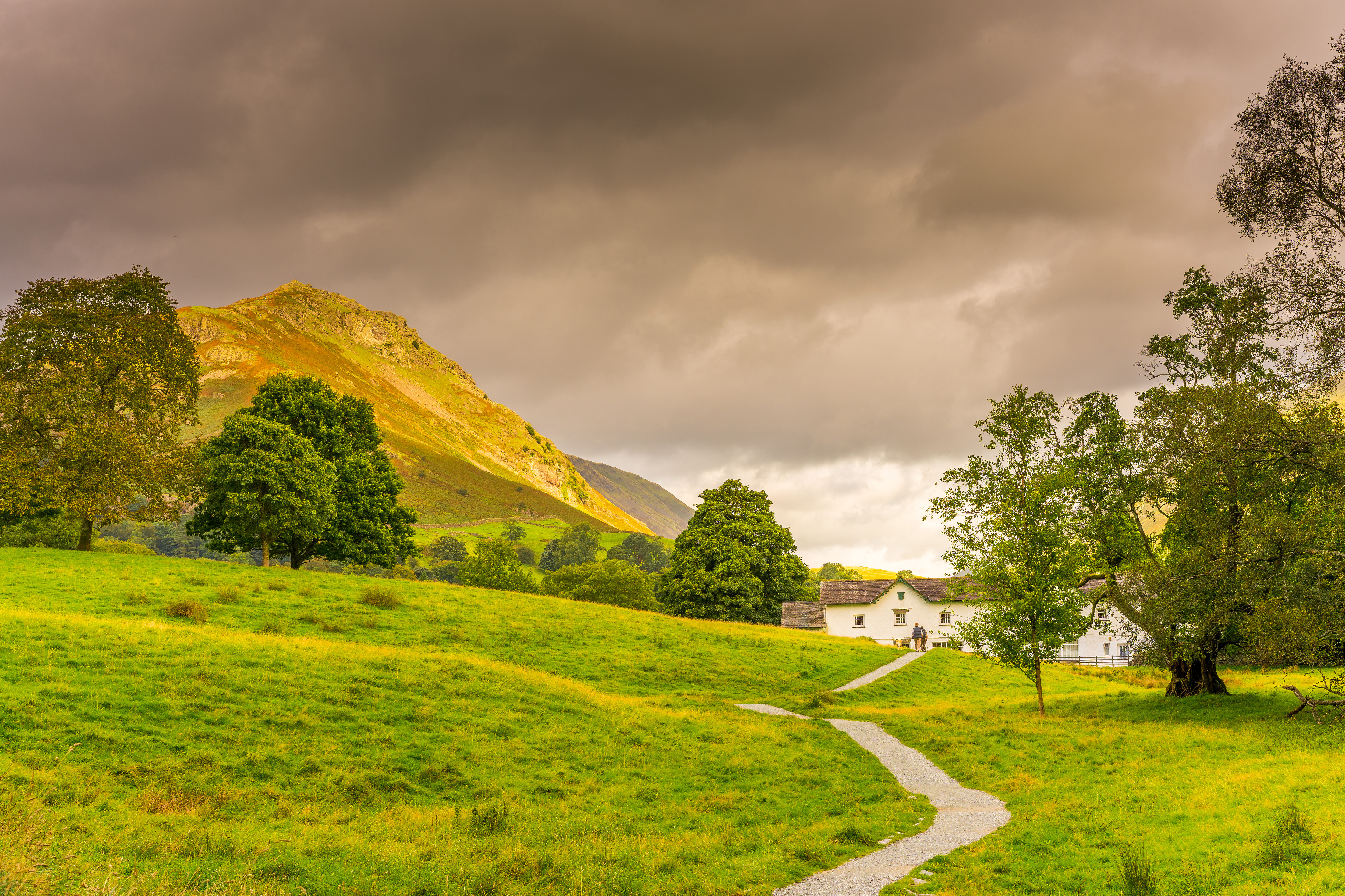Pathway to house with hills landscape image Free stock