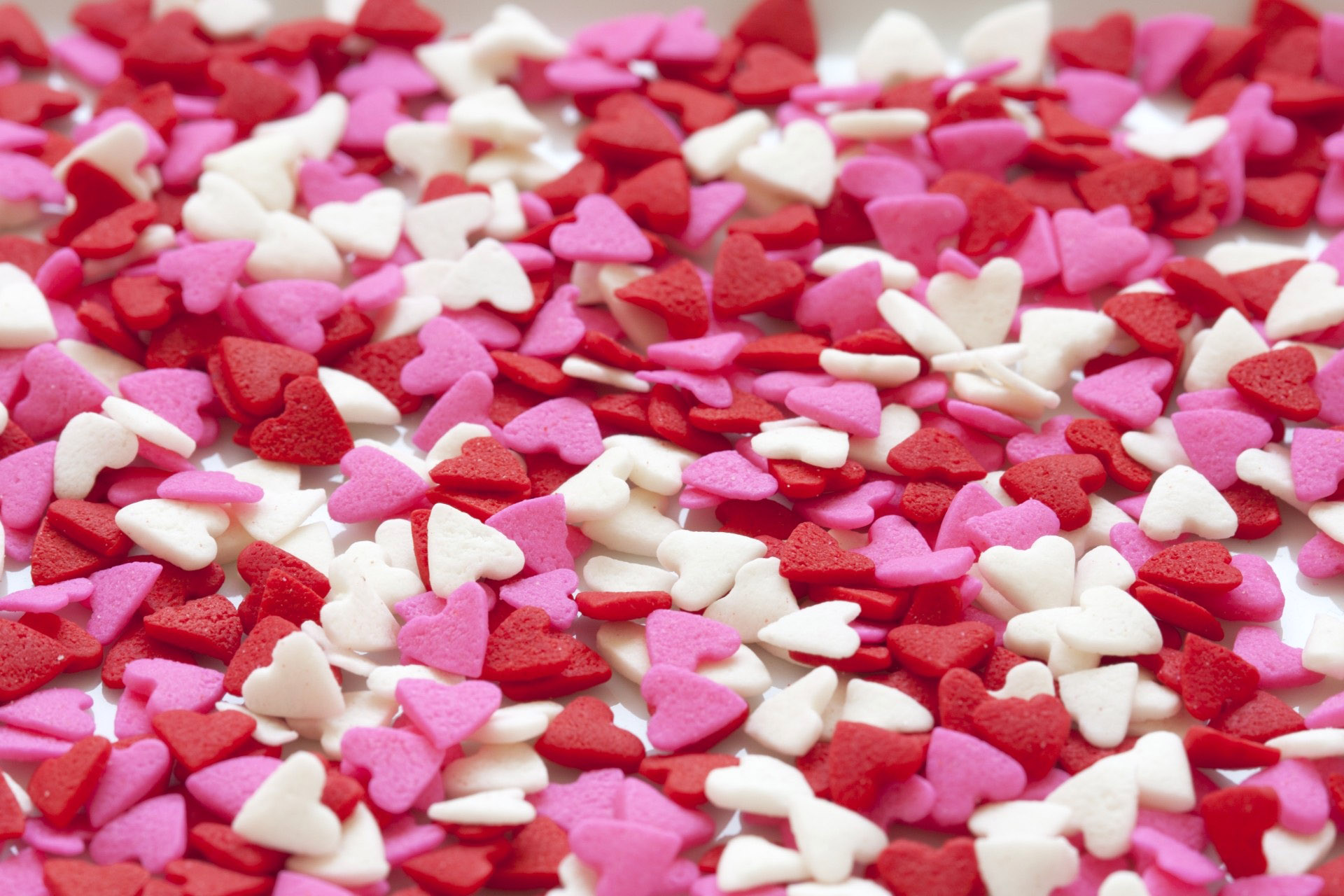 Chocolate cake balls stripped with pink candy melts for Valentines