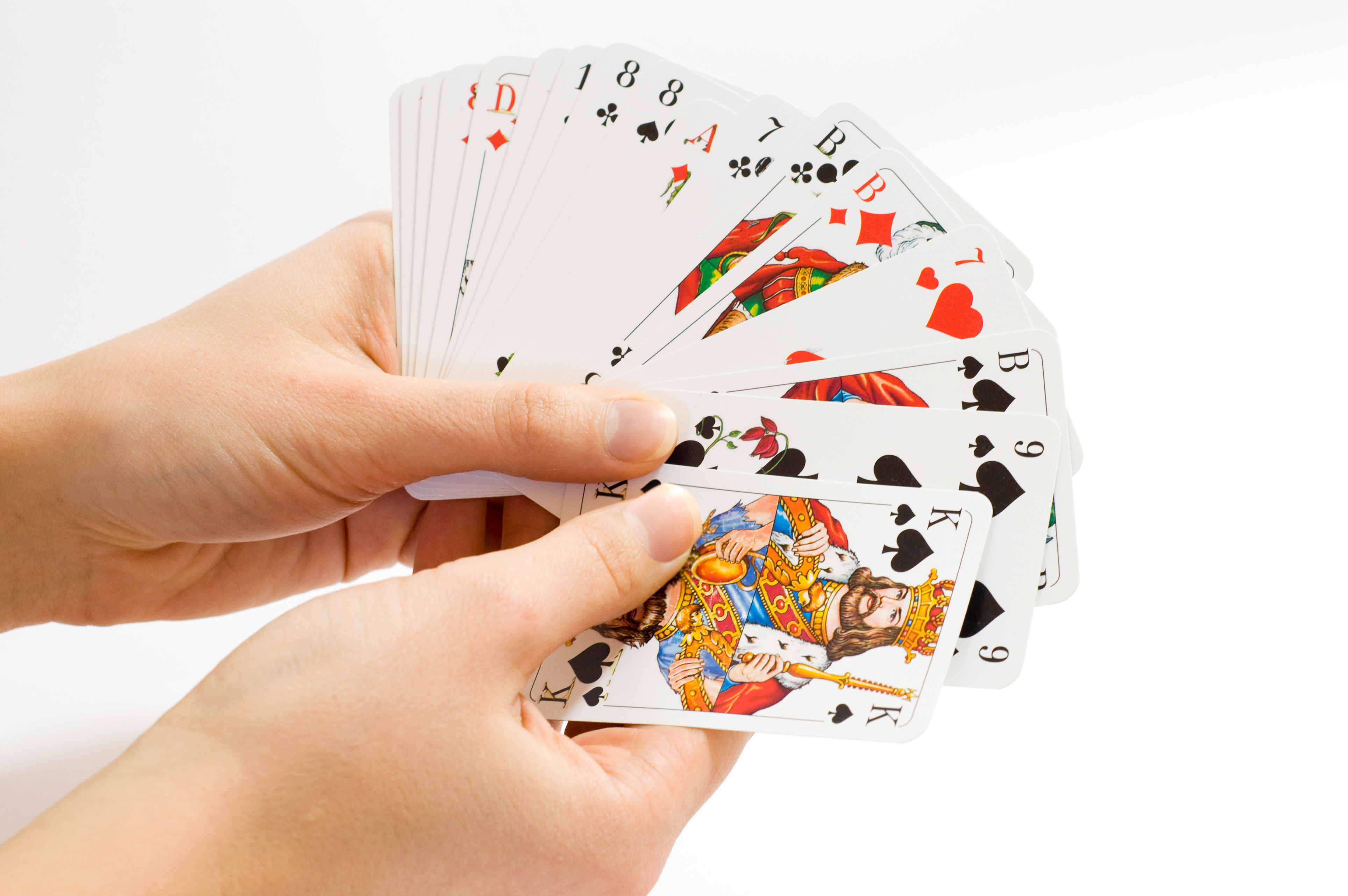 hand-holding-a-bunch-of-playing-cards.jpg