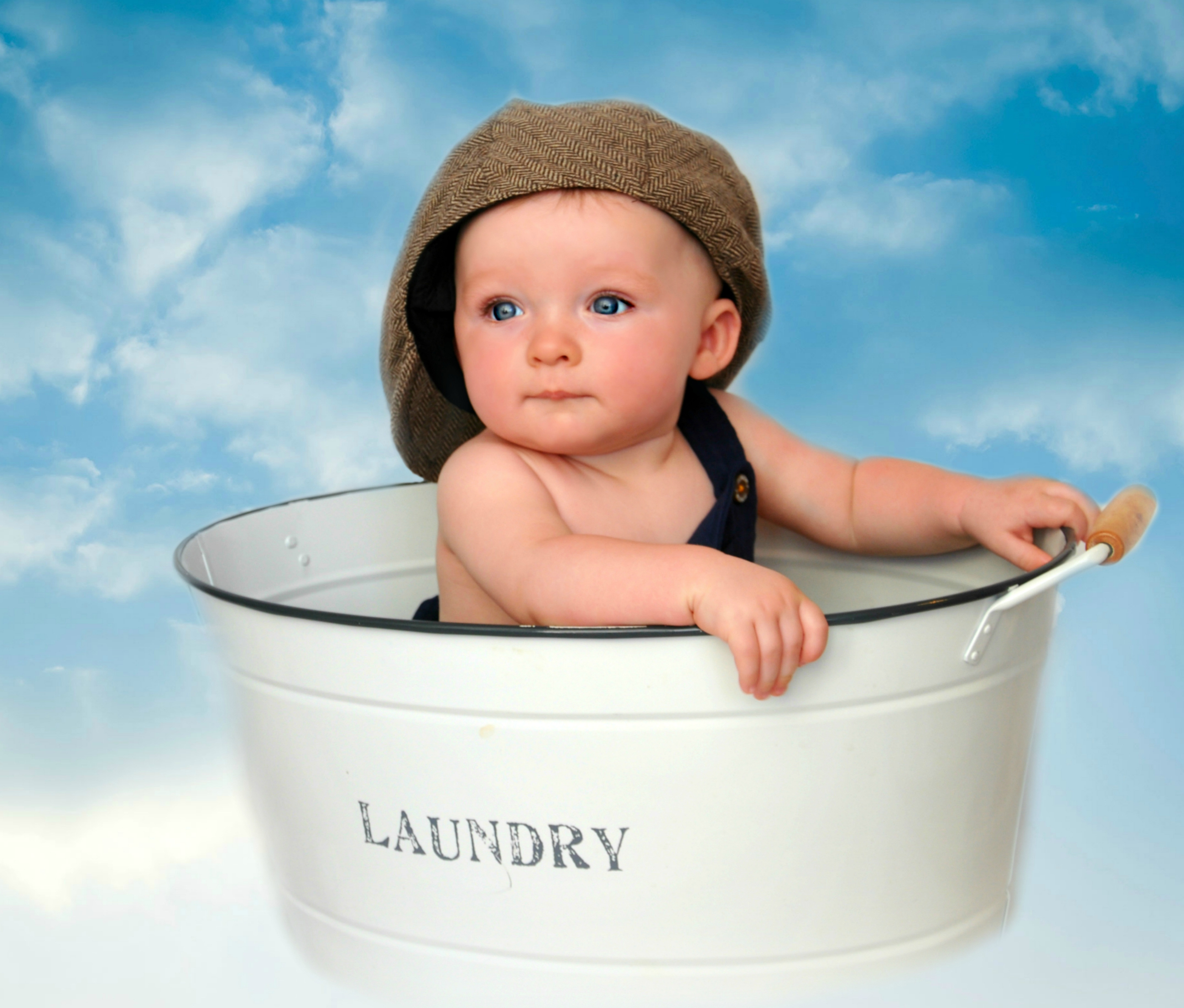 Baby in a laundry bucket image - Free stock photo - Public Domain