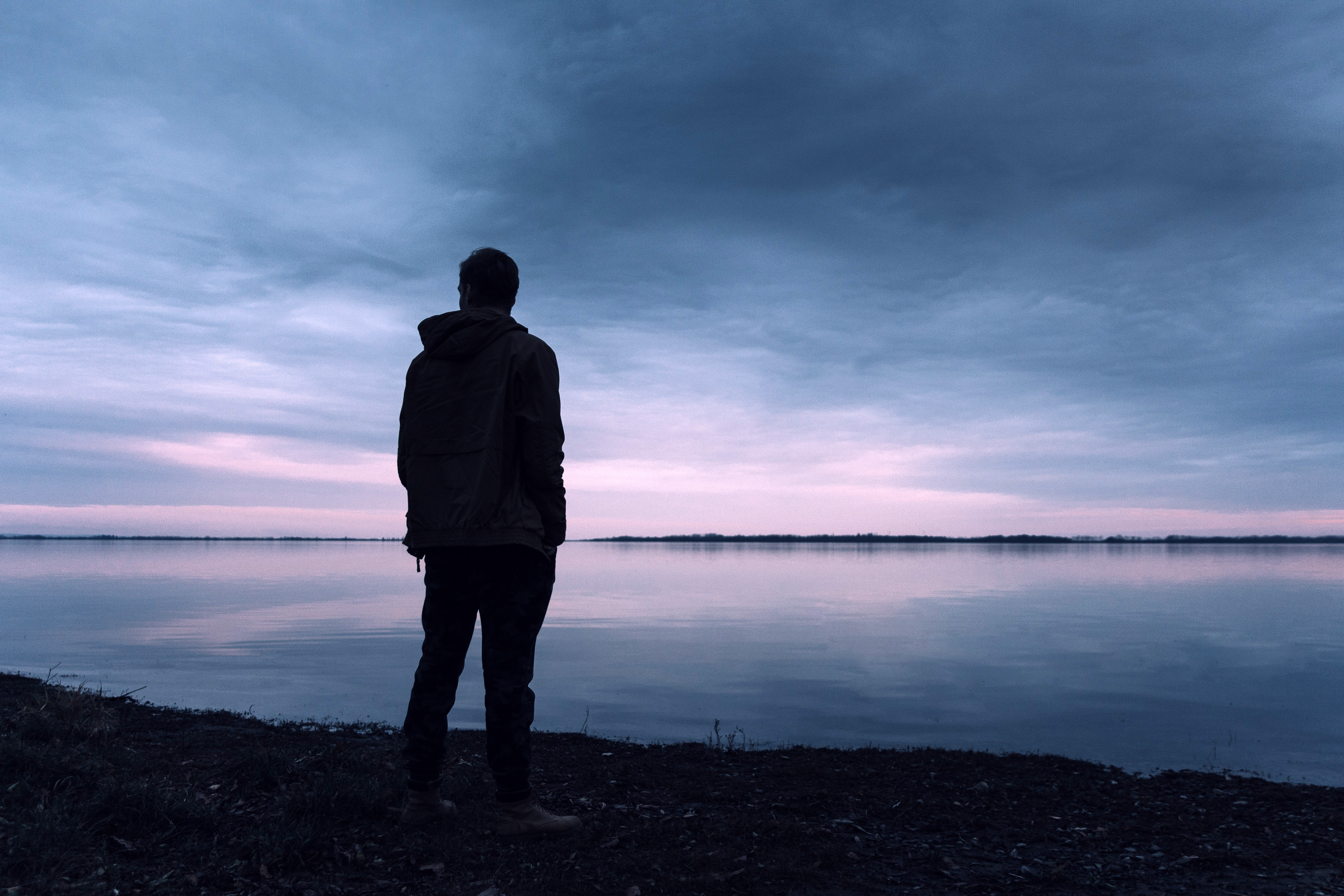 Blue Light on Man Standing by Lake · Free Stock Photo