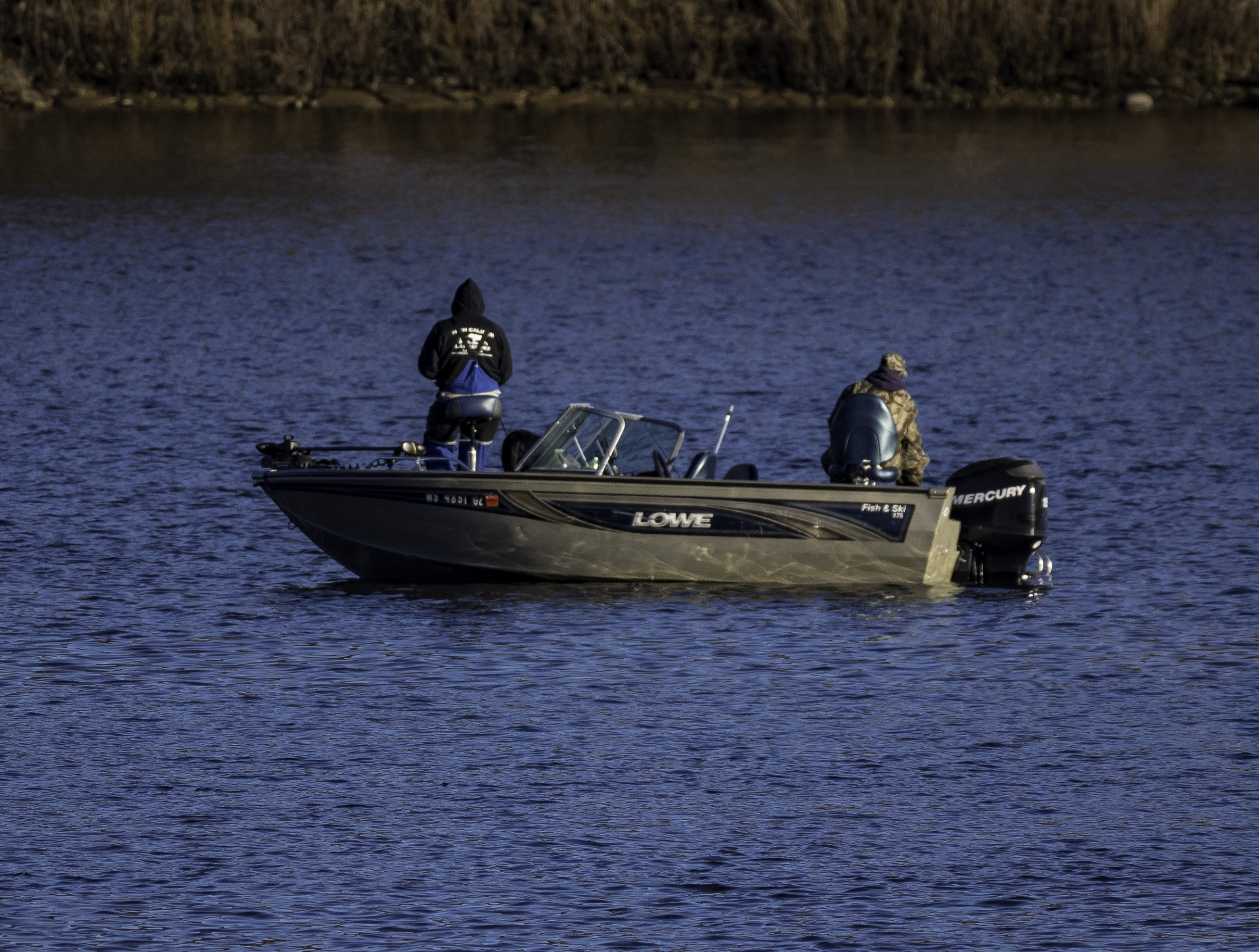 two-people-in-a-fishing-boat image - Free stock photo - Public