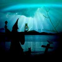Creepy Witch in fantasy blue landscape with lightning
