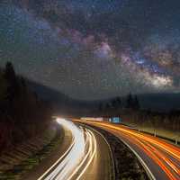 Milky Way Stars over the lighted highway
