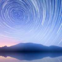 Star Trails in the sky over the mountain and mountains
