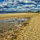 Beach with clouds in the sky in Tasmania, Australia