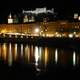 The fortress, Cathedral, and river at night in Salzburg, Austria