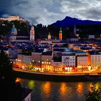 Riverfront lights and cityscape in Salzburg, Austria