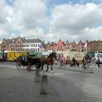 Belgique with horse carriage and streets in Brussels, Belgium
