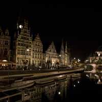 River and cityscape at night in Ghent, Belgium